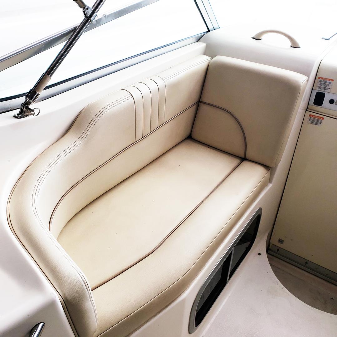 White mini yacht cruiser boat rental showing back seats at Lake Lewisville
