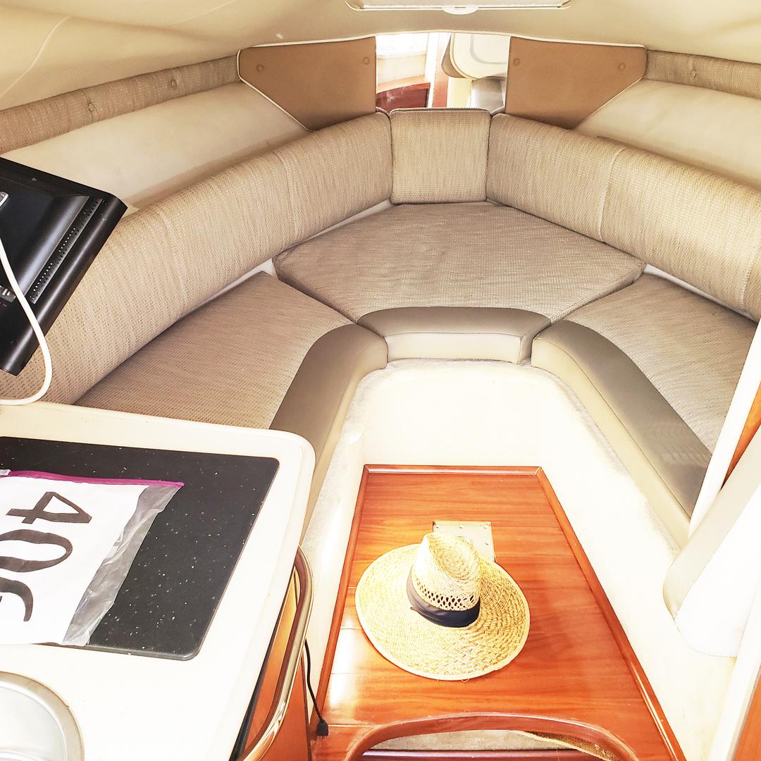 Inside cabin view of a white mini yacht cruiser boat rental at Lake Lewisville
