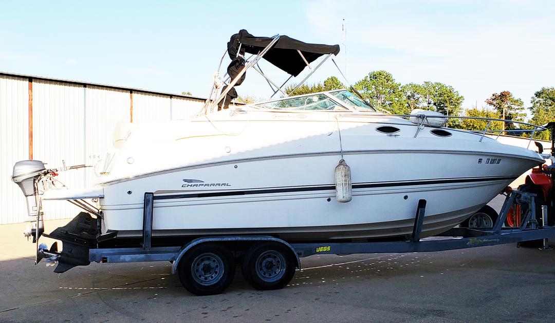 Side view of a white mini yacht cruiser boat rental at Lake Lewisville